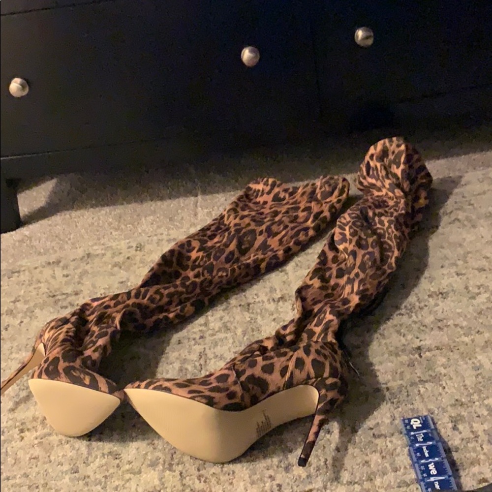Thigh high cheetah print boots